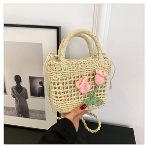 Fashionable handmade straw handbag with floral crochet tulip decor and long strap