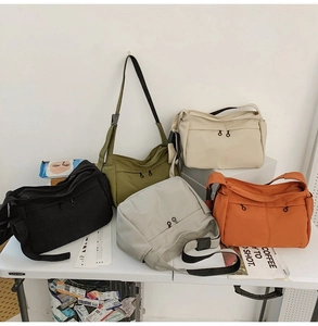 Multiple colors of lightweight nylon crossbody bags with adjustable shoulder straps