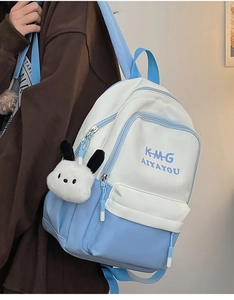 Blue and white polyester backpack featuring logo print and cute plush animal charm detail
