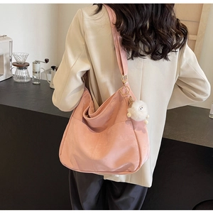 Pink oversized Hobo shoulder bag in soft PU leather with white plush toy detail