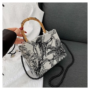 Fashionable Toile de Jouy print box bag with bamboo handle and black beaded chain strap