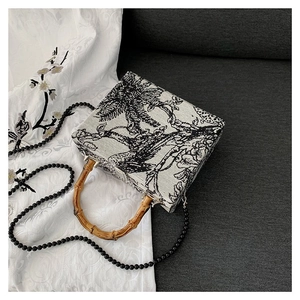 French vintage style fabric handbag with bamboo handle and black beaded shoulder strap