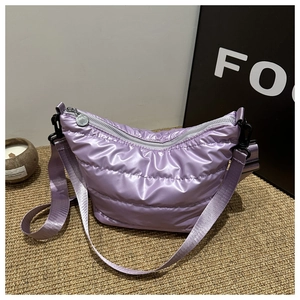 Quilted lavender crescent crossbody bag made of high-gloss nylon with padded strap