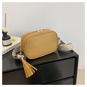 Brown lychee leather crossbody camera bag with wide geometric strap and golden hardware