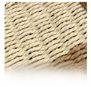 Detailed macro view of woven cream and beige straw texture with premium braided pattern
