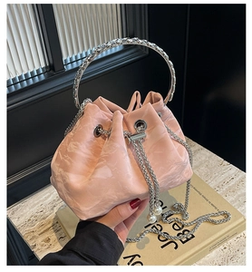 Pink marble pattern bucket bag with silver handles and pearl drawstring detail