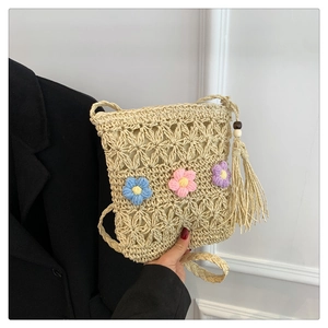 Chic cream straw crossbody bag with colorful crochet flowers and wooden bead tassels