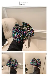 Multicolor sequin bucket bag featuring a silver chain strap with pearl charms and drawstring