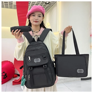 Ensemble 3 pièces en nylon noir comprenant sac à dos, sac fourre-tout et pochette