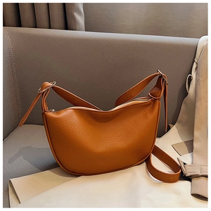 Chic orange-brown crescent PU leather crossbody bag with lychee texture and metal buckle