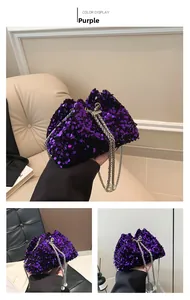 Detail view of purple sequin bucket bag with silver chain straps and pearl accents
