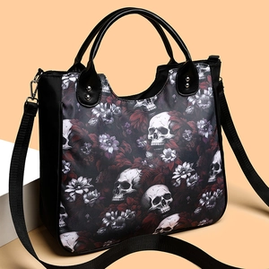 Gothic skull and purple floral print crossbody bag with black handles and shoulder strap