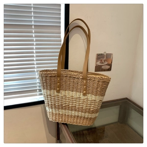 Fashionable woven straw tote bag with brown leather handles for women's summer vacation
