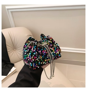 Detail of colorful sequin bucket bag with silver metal chain and pearl accent