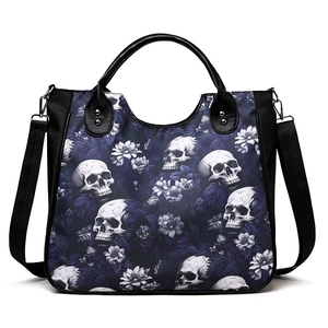 Fashionable black crossbody handbag with white skull and floral prints on canvas fabric