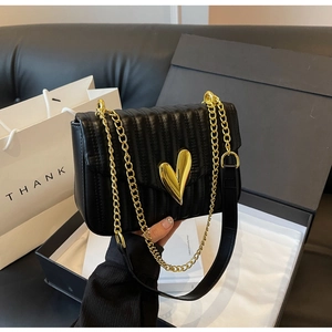 Fashionable black quilted PU leather crossbody bag with a golden heart-shaped metal clasp