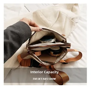 Internal capacity of minimalist PU crossbody bag showing phone and cosmetics storage