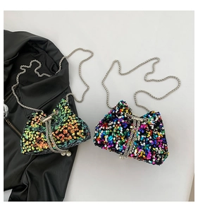 Detail of sparkly sequin mini bucket bags with silver chain straps and pearl drawstrings