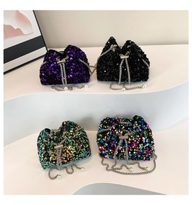 Detailed display of sequin bucket bags with metal chain straps and pearl charms