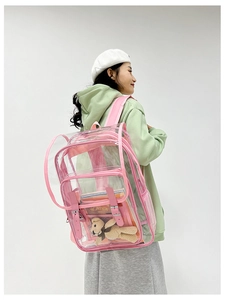 Detail of transparent pink PVC backpack with adjustable straps showing large interior capacity