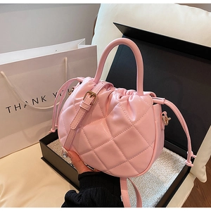 Pink quilted PU leather crossbody bag with drawstring closure and metal hardware detail