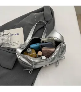 Detail view of the spacious silver metallic PU tote bag showing large interior capacity