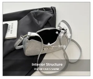 Detail of the sparkling rhinestone handbag showing the main pocket and internal structure