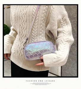 Detail view of iridescent mermaid scale texture on a purple PU crossbody bag