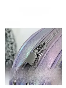 Detail of metallic purple PU leather texture and smooth silver metal zipper closure