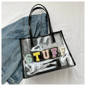 Street style transparent PVC tote bag with colorful STUFF patches and black inner pouch