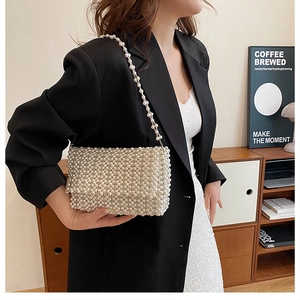 Elegant white pearl beaded shoulder bag with fine hand-woven texture for women