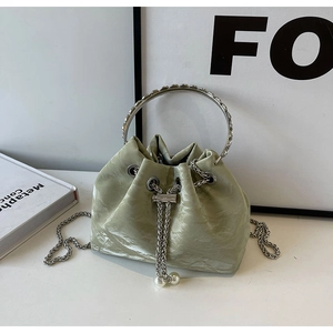 Fashionable mint green velvet drawstring bucket bag with pearl beads and chain strap
