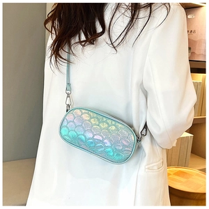 Detail of holographic cross body bag with iridescent fish scale texture on white blazer