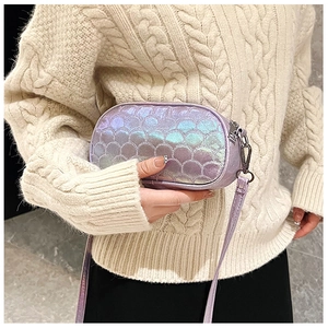 Detail showing laser iridescent purple PU leather texture on a fashion crossbody bag