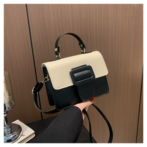 Fashionable black and cream PU leather crossbody bag with a large square buckle detail