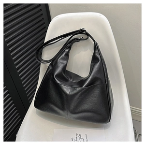 Minimalist black PU leather hobo bag with lychee texture and adjustable strap for women