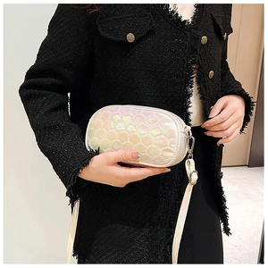 Detail showing pearlescent fish scale texture on fashion cream PU crossbody bag