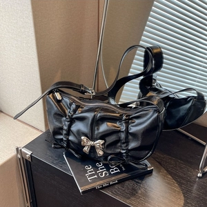 Chic black pleated PU leather shoulder bag with a silver metal bow and adjustable strap