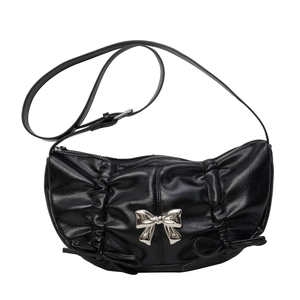Fashionable black crescent PU leather shoulder bag with chic silver metal bows and pleats