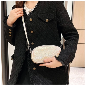 Detail of pearlescent PU crossbody bag with iridescent shell pattern and metal zipper