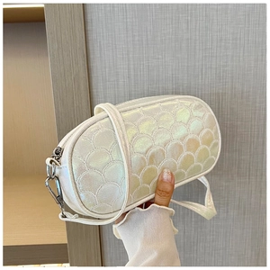 Holographic white crossbody bag with quilted shell pattern and silver metal hooks