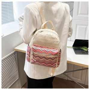 Close-up of woven ethnic pattern details on a beige backpack for daily leisure use