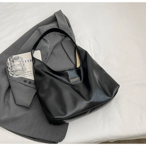 Minimalist black shiny PU leather tote bag with wide shoulder strap for office fashion