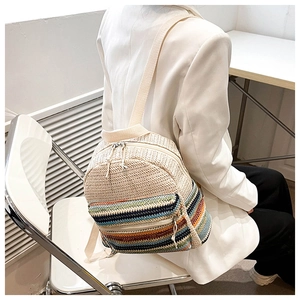 Detailed close-up showing the colorful woven texture and striped design of the backpack