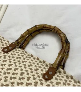 Detail view of woven handbag featuring natural bamboo handle and dark brown leather connectors