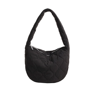 Minimalist black quilted nylon crescent shoulder bag with a sleek silver zipper closure