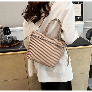 Fashionable beige pleated PU crossbody bag with drawstring closure and top handle