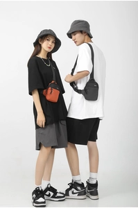 Mini nylon crossbody bags in black and orange shown on male and female models