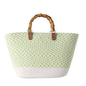 Woven straw tote bag with green herringbone pattern and bamboo-style top handles