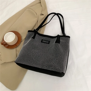 Chic black tote bag for women with silver rhinestone studs and long shoulder straps